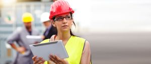 Female engineer with mobile device