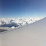 Airplane wing above the clouds