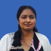 Professional headshot of Snetu, smiling.