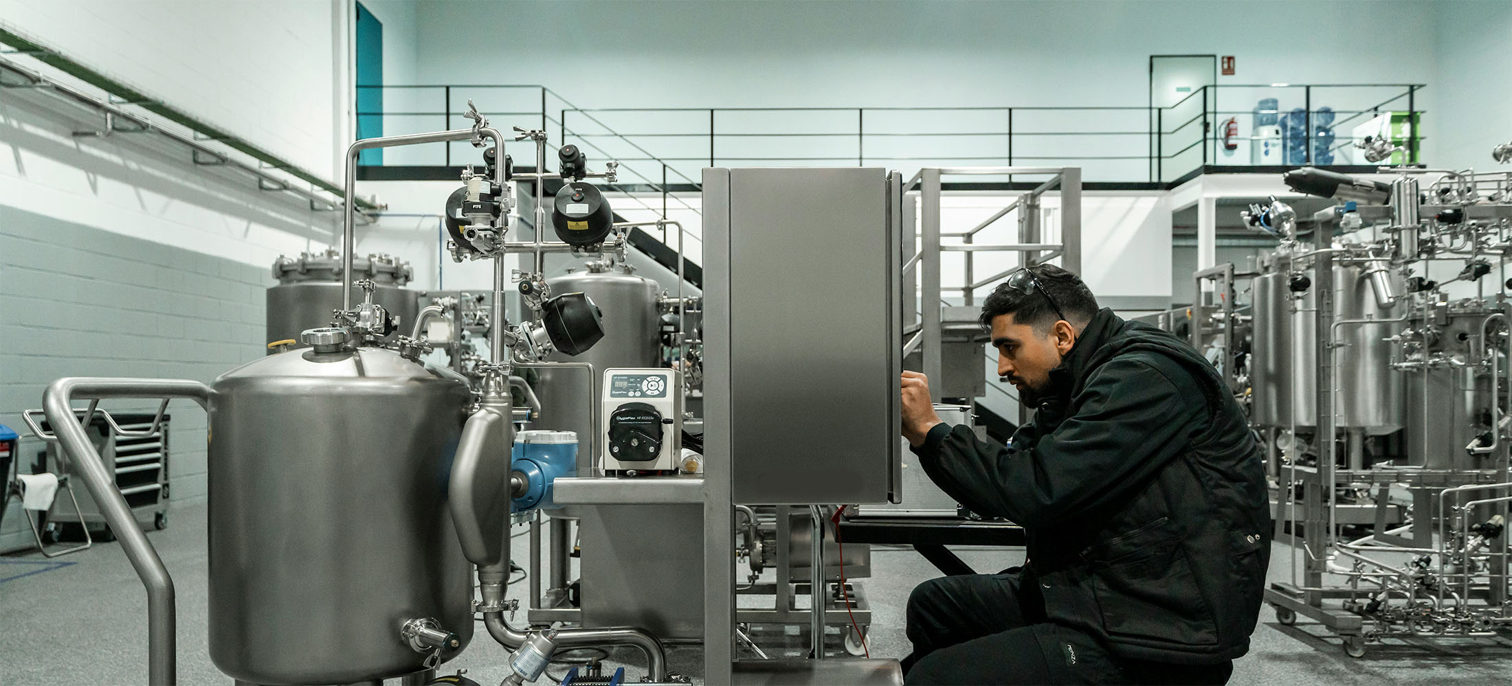 Technician verifying data points at chemical manufacturing plant.